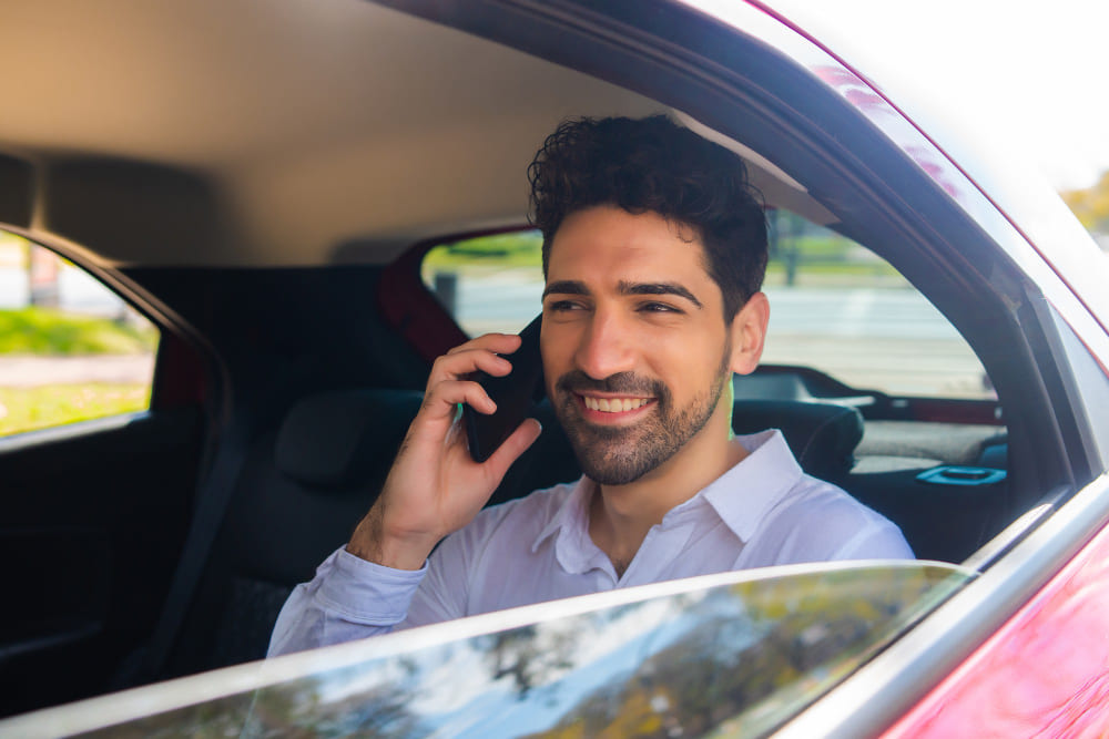 Corporate taxi in Patna – business traveller in the back seat of a Patna Cabs car